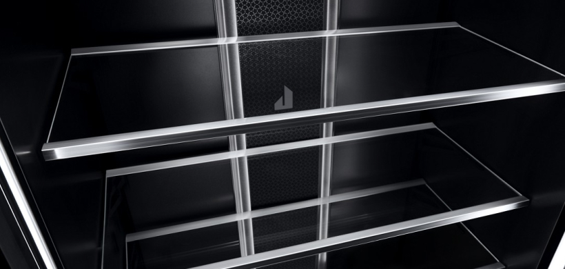  Empty shelves inside a JennAir Refrigerator.